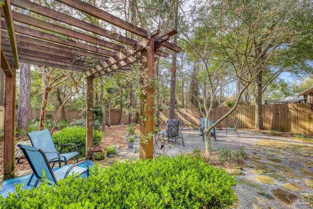 view of yard with a patio, a fenced backyard, and a pergola