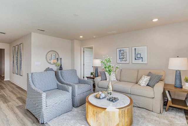 living room with light hardwood / wood-style flooring