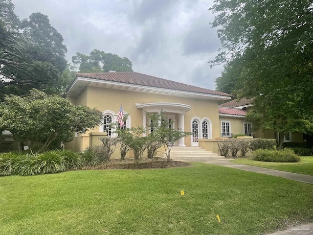1904 E Larua St, Pensacola, FL 32501 - view of front of property featuring a tile roof, a front lawn, and stucco siding