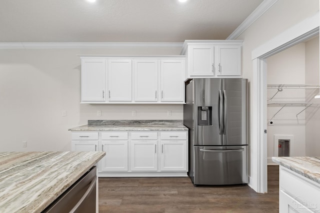 kitchen featuring white cabinetry, light stone countertops, dark wood-type flooring, crown molding, and stainless steel refrigerator with ice dispenser