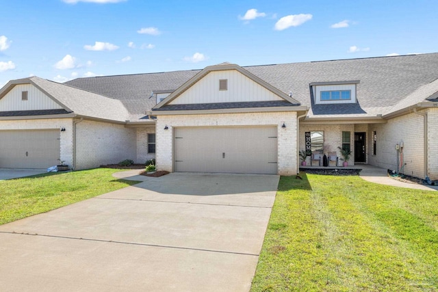 view of front of home with a garage and a front lawn