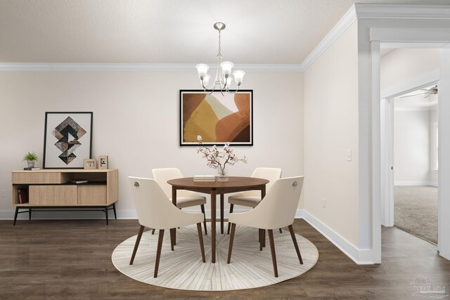 dining room featuring dark wood-type flooring, crown molding, and ceiling fan with notable chandelier