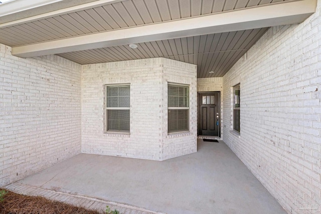 doorway to property featuring a patio