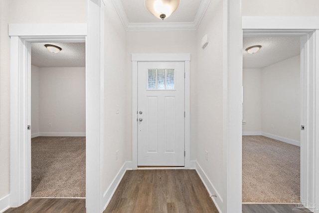 foyer entrance with crown molding, a textured ceiling, and dark hardwood / wood-style floors