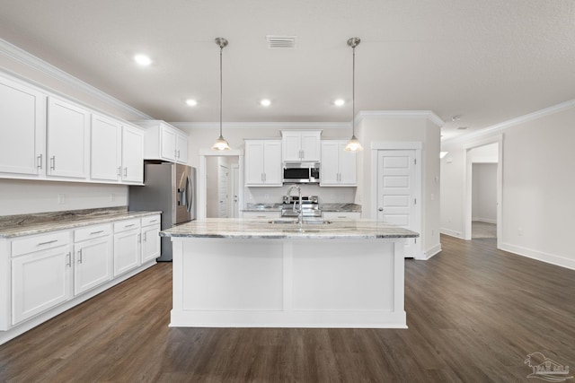 kitchen featuring hanging light fixtures, an island with sink, appliances with stainless steel finishes, white cabinetry, and dark wood-type flooring