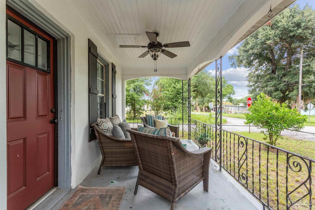 balcony with ceiling fan and covered porch