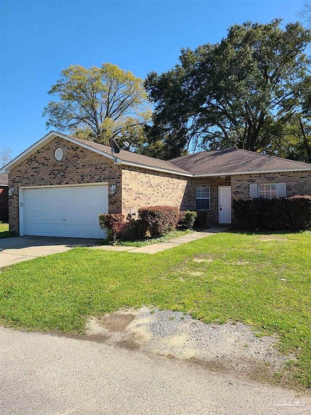 ranch-style home featuring brick siding, an attached garage, concrete driveway, and a front lawn