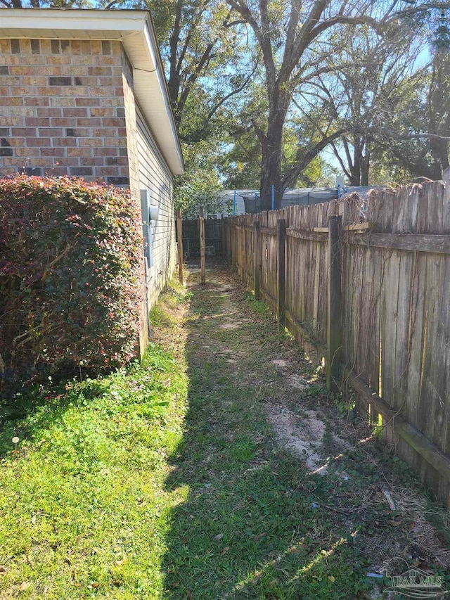 view of yard with a fenced backyard