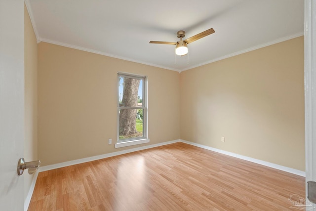 empty room featuring light hardwood / wood-style flooring, ceiling fan, and crown molding