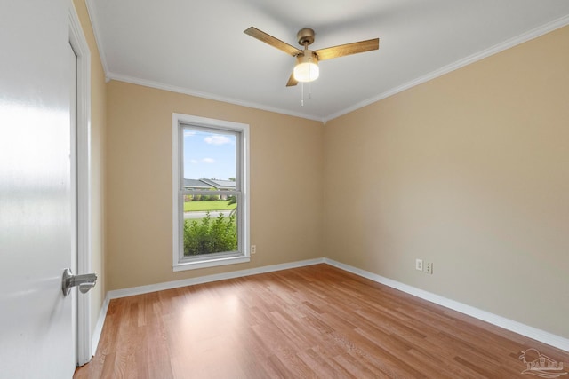 spare room with crown molding, light hardwood / wood-style flooring, and ceiling fan