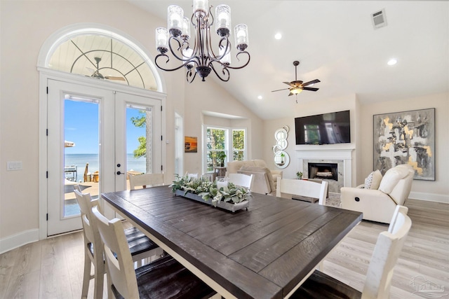 5136 Point Shores Ln, Gulf Breeze, FL 32563 - dining area featuring visible vents, a fireplace, baseboards, french doors, and light wood-style flooring