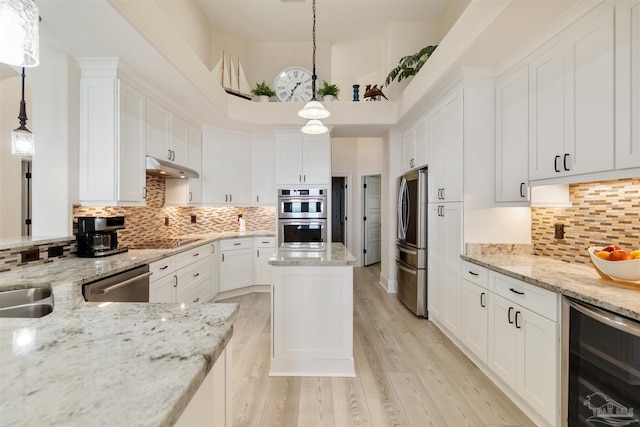5136 Point Shores Ln, Gulf Breeze, FL 32563 - kitchen featuring white cabinetry, wine cooler, and stainless steel appliances