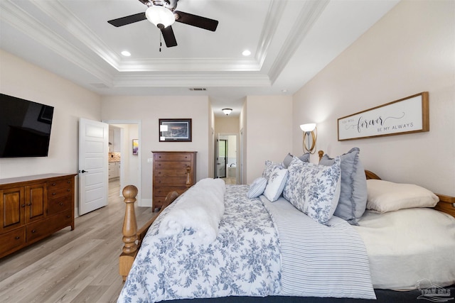 5136 Point Shores Ln, Gulf Breeze, FL 32563 - bedroom featuring visible vents, ornamental molding, a raised ceiling, and light wood-style floors