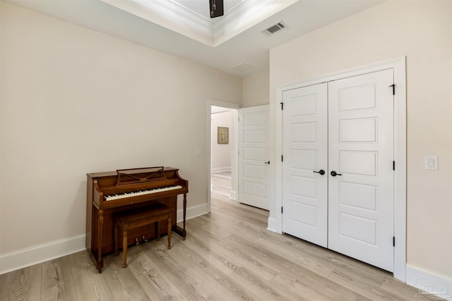 5136 Point Shores Ln, Gulf Breeze, FL 32563 - sitting room featuring crown molding, baseboards, visible vents, and light wood-style flooring