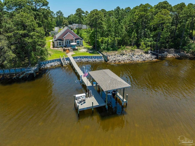 5136 Point Shores Ln, Gulf Breeze, FL 32563 - view of dock featuring a yard, boat lift, a view of trees, and a water view