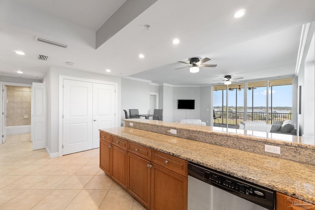 kitchen with dishwasher, light stone counters, open floor plan, and visible vents