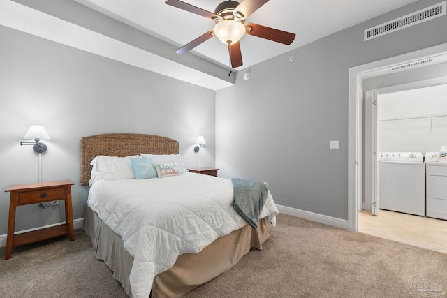 bedroom featuring washer and clothes dryer, visible vents, light carpet, ceiling fan, and baseboards