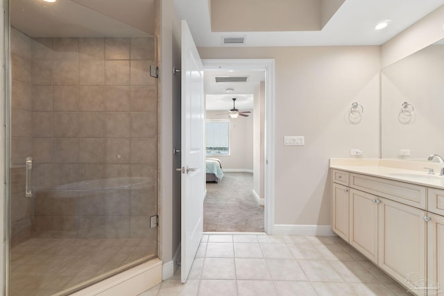 bathroom with visible vents, connected bathroom, vanity, baseboards, and tile patterned floors