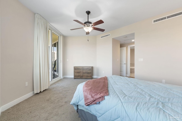 bedroom featuring light carpet, visible vents, and baseboards