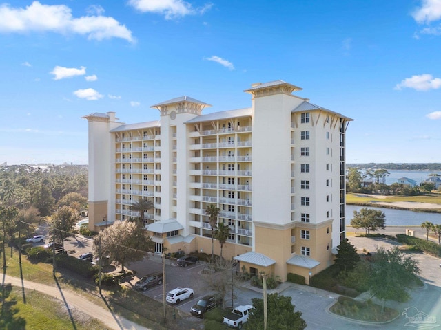 view of building exterior with a water view