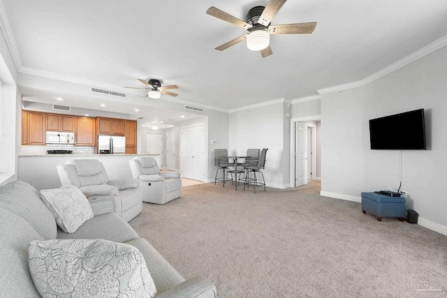 living room with baseboards, visible vents, crown molding, and light colored carpet