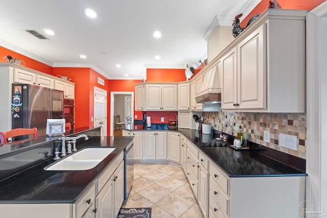 kitchen with sink, stainless steel fridge, backsplash, custom exhaust hood, and crown molding