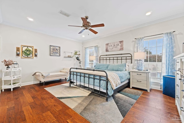 bedroom featuring crown molding, ceiling fan, and dark hardwood / wood-style flooring