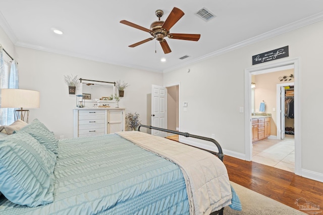 bedroom with ornamental molding, ceiling fan, and light hardwood / wood-style floors