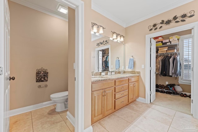 bathroom featuring crown molding, tile patterned floors, toilet, and vanity