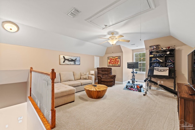 carpeted living room with vaulted ceiling