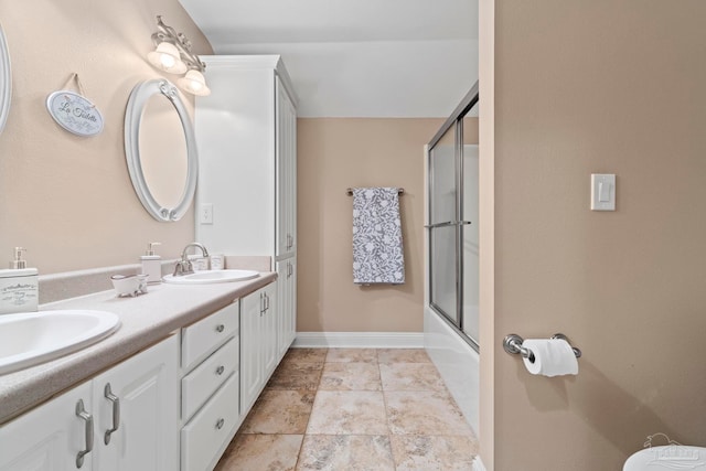 bathroom featuring vanity and enclosed tub / shower combo