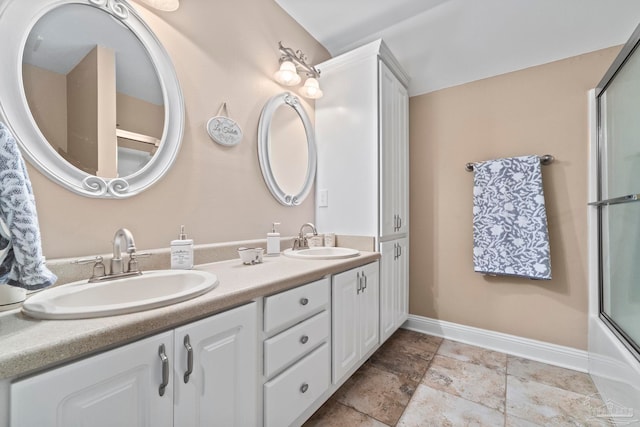 bathroom featuring vanity and shower / bath combination with glass door