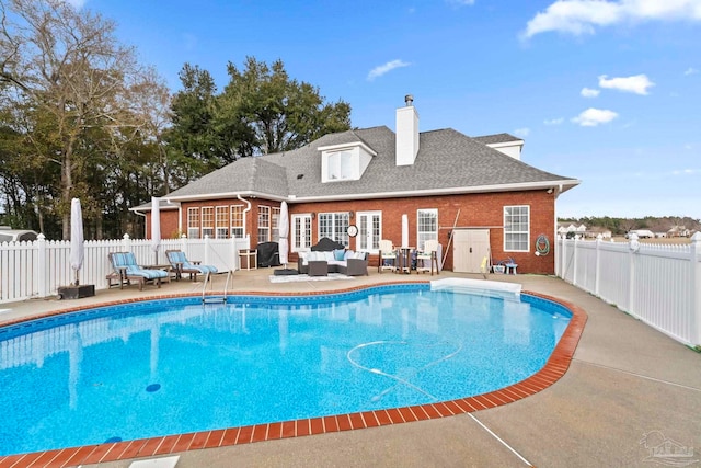 view of swimming pool featuring outdoor lounge area and a patio