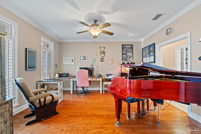 misc room with hardwood / wood-style flooring, ornamental molding, plenty of natural light, and ceiling fan