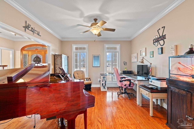 office space with crown molding, ceiling fan, and light hardwood / wood-style flooring