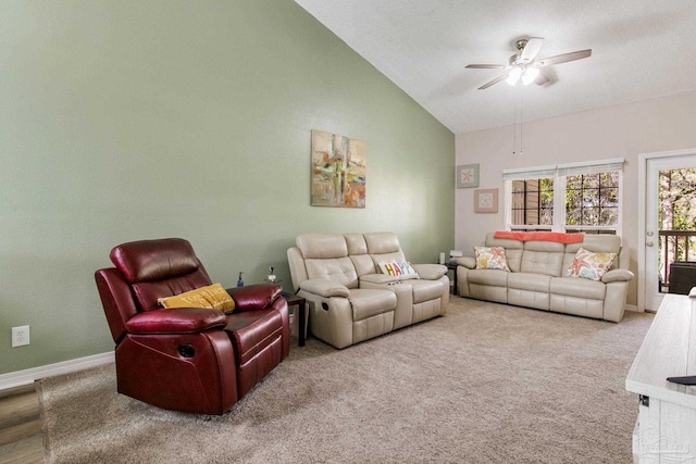 carpeted living room with ceiling fan and lofted ceiling