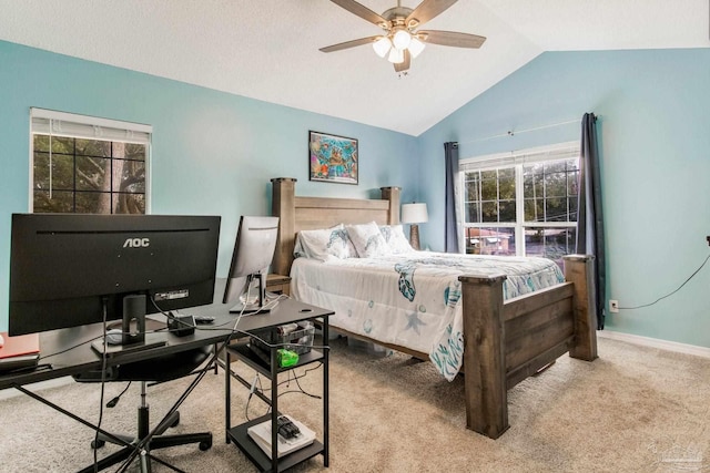 bedroom with vaulted ceiling, ceiling fan, and light carpet