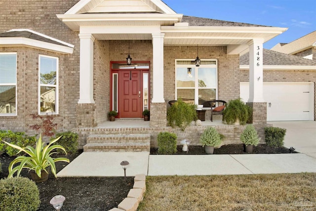 property entrance featuring a garage and a porch