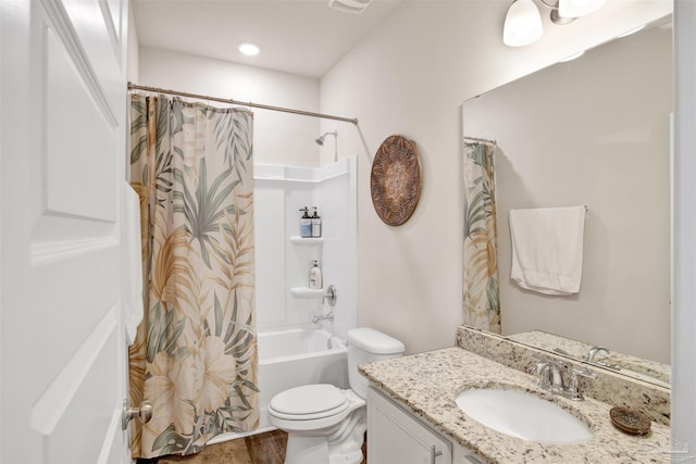 full bathroom with shower / tub combo, vanity, and toilet