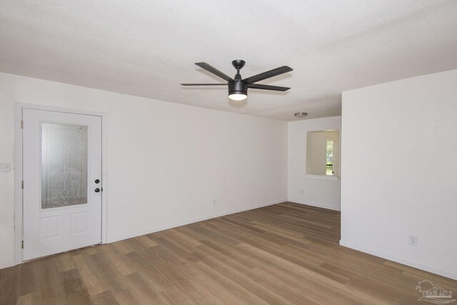 60 Stanford Rd, Pensacola, FL 32506 - spare room featuring a ceiling fan, light wood-style flooring, baseboards, and a textured ceiling