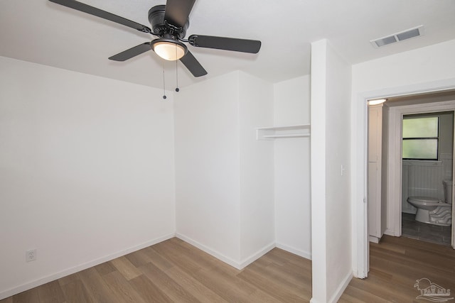 60 Stanford Rd, Pensacola, FL 32506 - unfurnished bedroom featuring a closet, visible vents, ceiling fan, wood finished floors, and baseboards