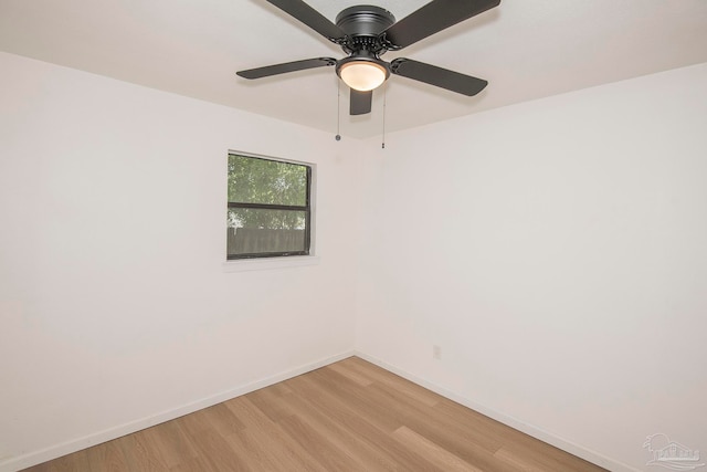 empty room with ceiling fan and light hardwood / wood-style floors