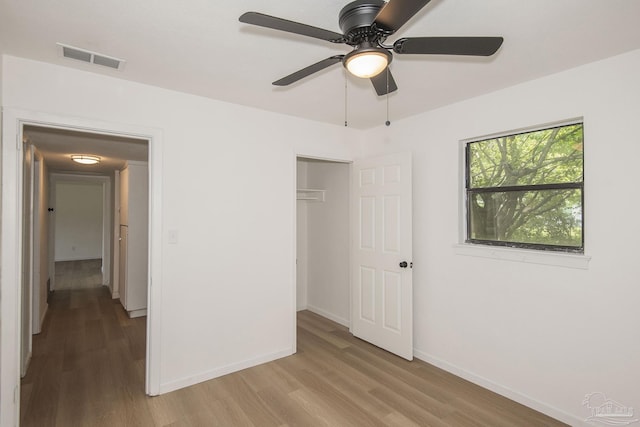 60 Stanford Rd, Pensacola, FL 32506 - unfurnished bedroom featuring a closet, visible vents, light wood-style flooring, and baseboards