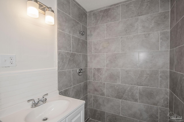 60 Stanford Rd, Pensacola, FL 32506 - bathroom featuring a tile shower and vanity