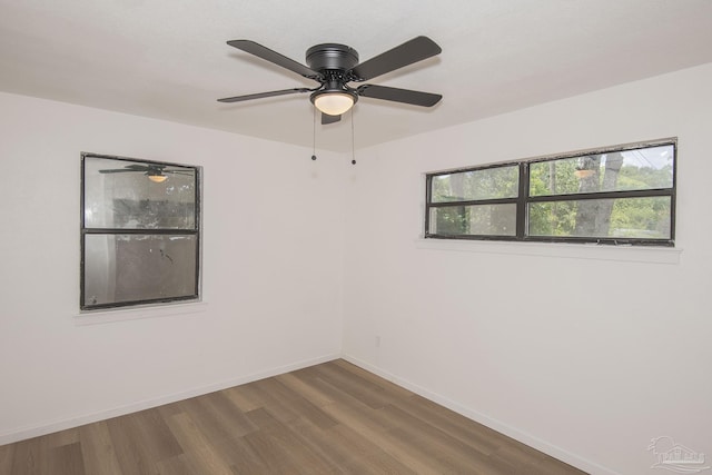 60 Stanford Rd, Pensacola, FL 32506 - empty room with a healthy amount of sunlight, baseboards, and wood finished floors