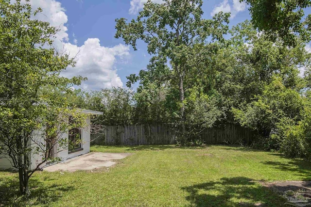 60 Stanford Rd, Pensacola, FL 32506 - view of yard featuring a patio area and a fenced backyard