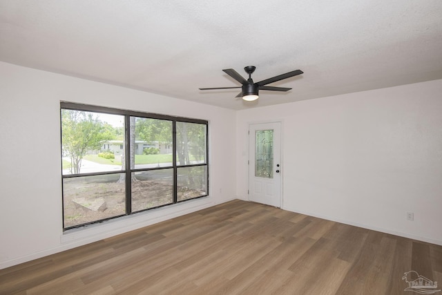 60 Stanford Rd, Pensacola, FL 32506 - spare room with a ceiling fan, a textured ceiling, baseboards, and wood finished floors