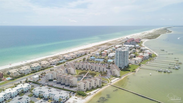 bird's eye view featuring a view of the beach and a water view