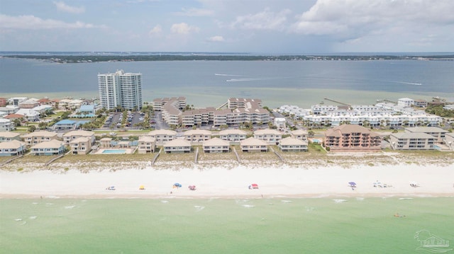 drone / aerial view with a beach view and a water view