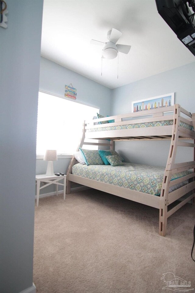 carpeted bedroom with ceiling fan